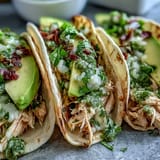 Juicy, shredded chicken for Slow Cooker Salsa Verde Chicken Tacos, ready to assemble.