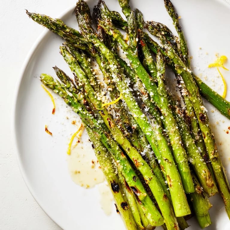 Freshly grilled asparagus, lightly charred, with a squeeze of lemon, promising a bright and simple side dish.